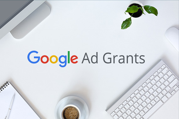 Image with technology items and Google Ad Grants logo